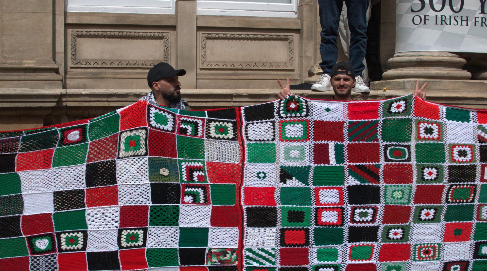 Irish demonstrators hold up a quilt symbolizing children who killed in Gaza during a pro-Palestinian rally in Dublin, July 19, 2025.
