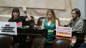 Argentina's Frente de Izquierda deputies Romina del Pla, Miryam Bregman, and Nicolas Del Cano (from left) sit at their desks during the oath ceremony at the Chamber of Deputies of the Argentine Congress in Buenos Aires on Dec. 3, 2025.
