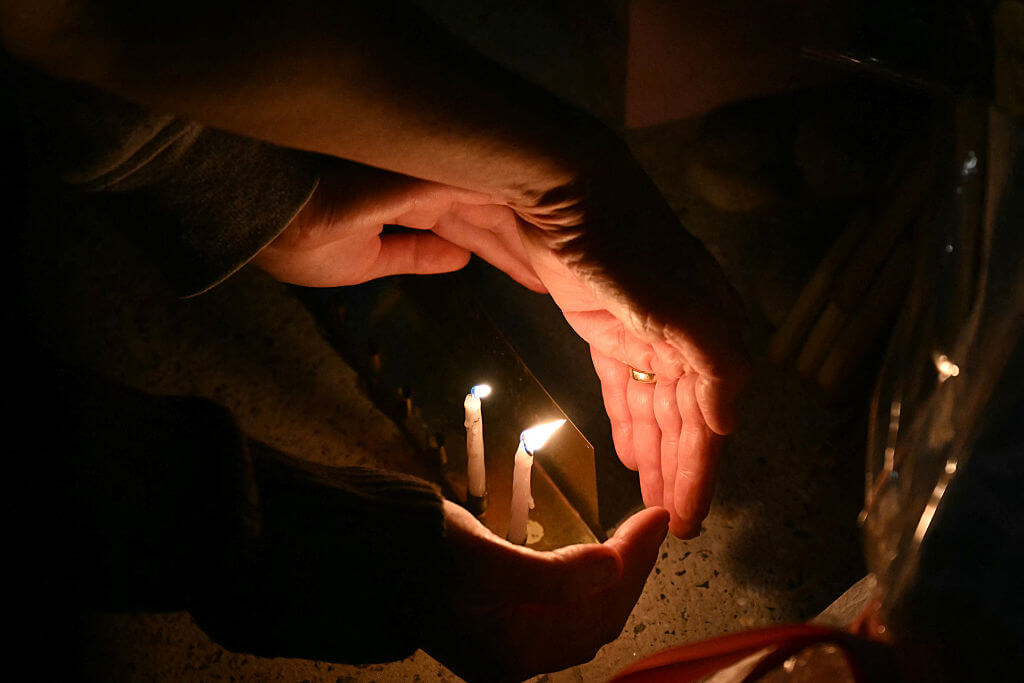 People light candles at the Bondi Pavillion in memory of the victims of a shooting targeting Jews at Bondi Beach, in Sydney.