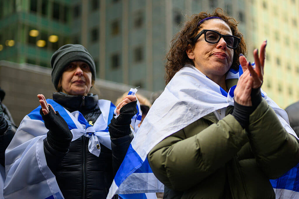 People gather outside the Australian consulate on December 14, in New York City for a vigil in support of the Australian Jewish community following a terrorist attack at a Hanukkah party in Sydney.