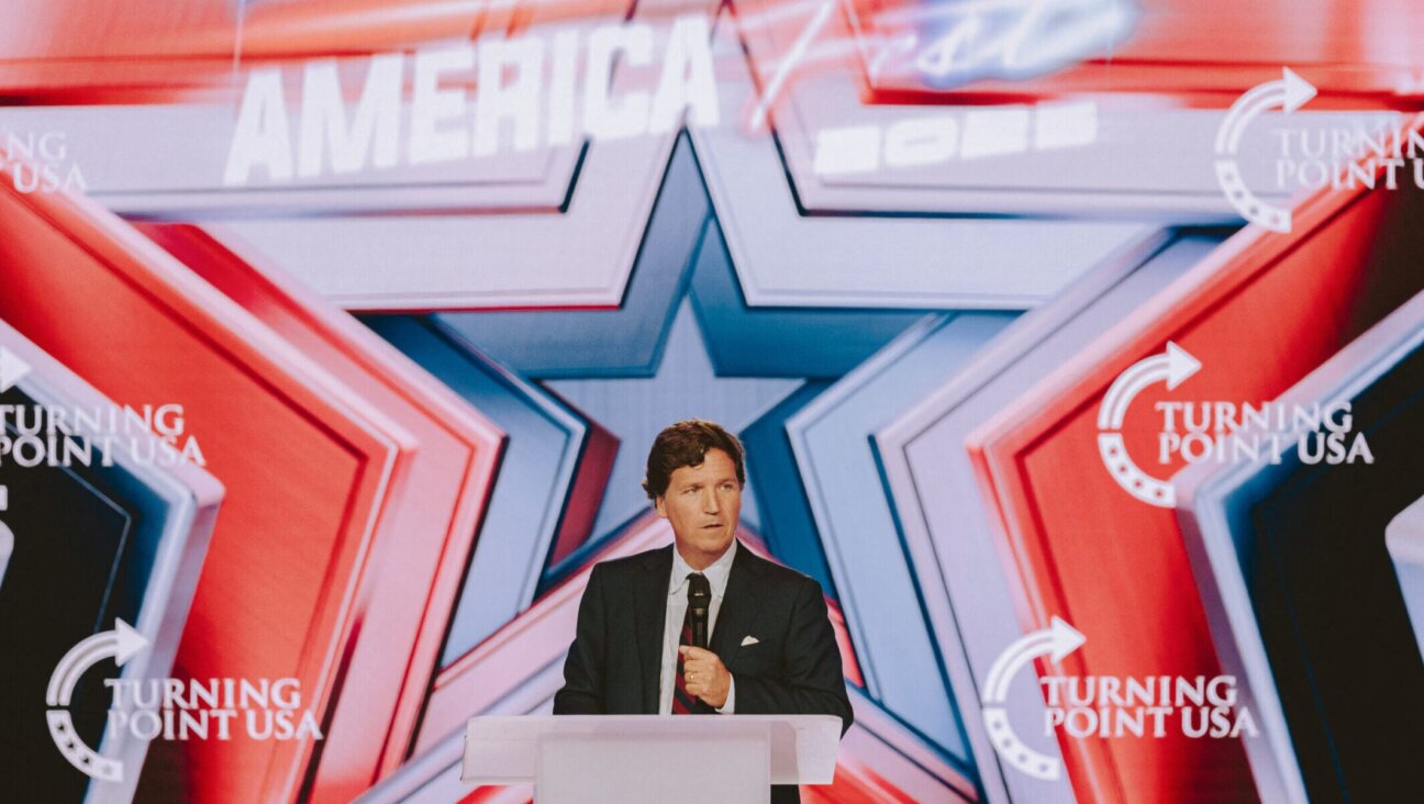 Conservative political commentator and podcast host Tucker Carlson speaks at Turning Point’s annual AmericaFest conference in Phoenix, Dec. 18, 2025. 