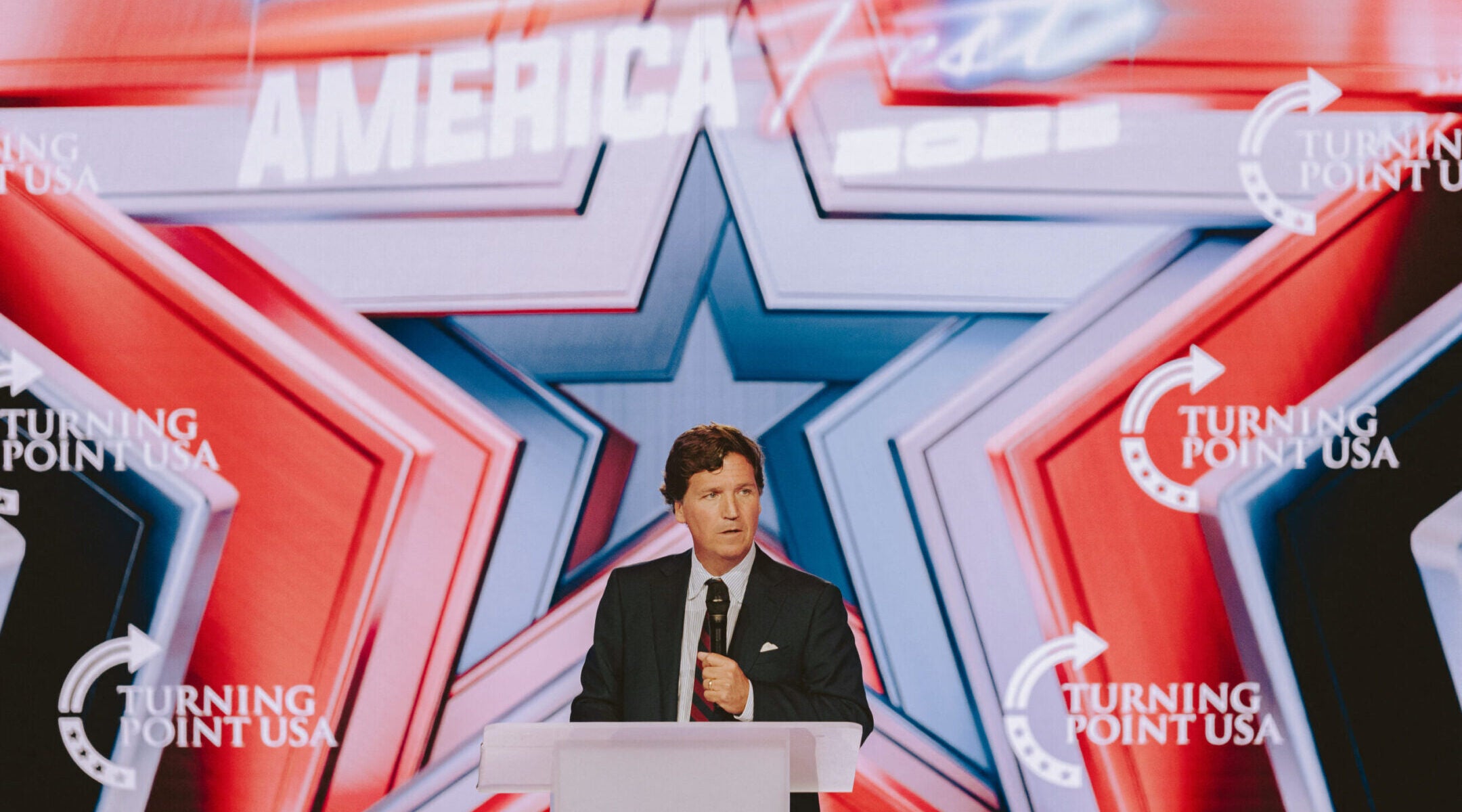 Conservative political commentator and podcast host Tucker Carlson speaks at Turning Point’s annual AmericaFest conference in Phoenix, Dec. 18, 2025. 