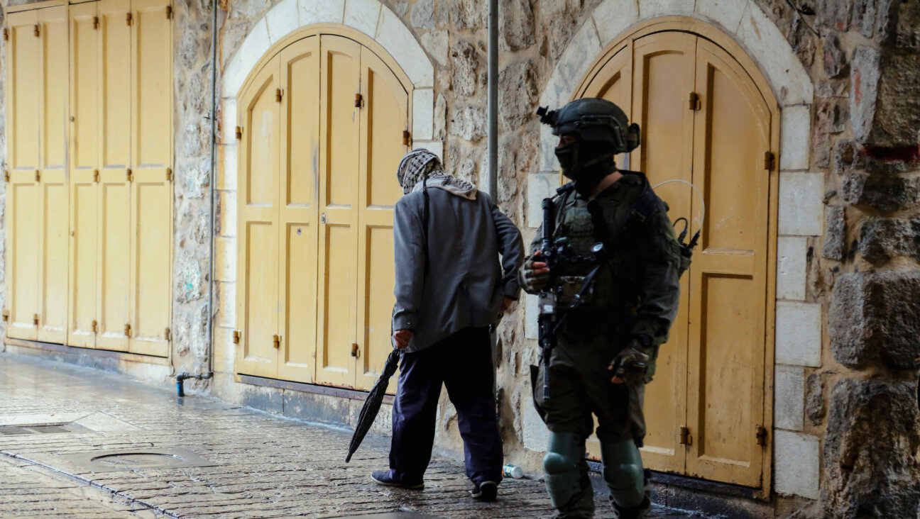 An Israeli soldier guards the Tomb of the Patriarchs, also known as Ibrahimi Mosque, in the Old City of Hebron, in the occupied West Bank, on Nov. 15.