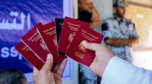 Palestinian port authority holds passports of passengers to show the press that they are leaving Gaza legally.
