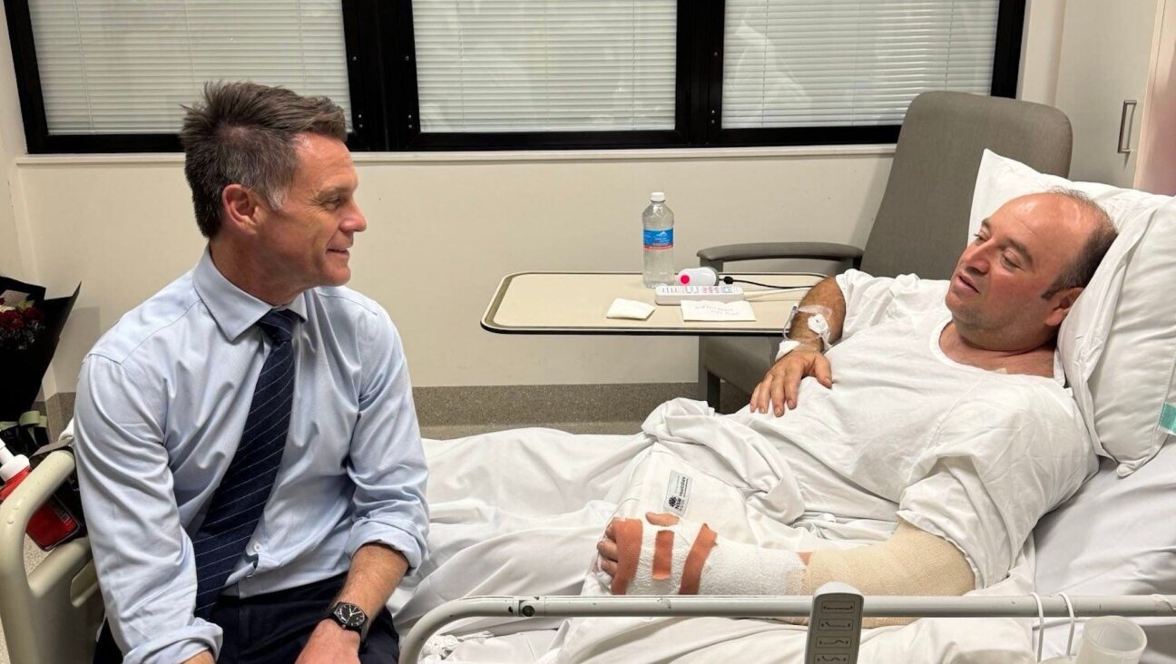 New South Wales Premier Chris Minns visits Ahmed Al Ahmed, 43, at a hospital in Sydney, Australia, on December 15, 2025. 