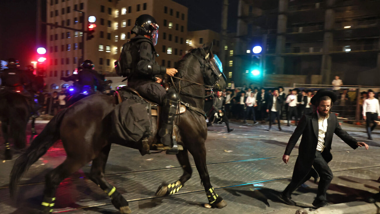 Israeli mounted police disperse Haredi Jewish men during a protest against conscription into Israel's military in Jerusalem on Oct. 30.