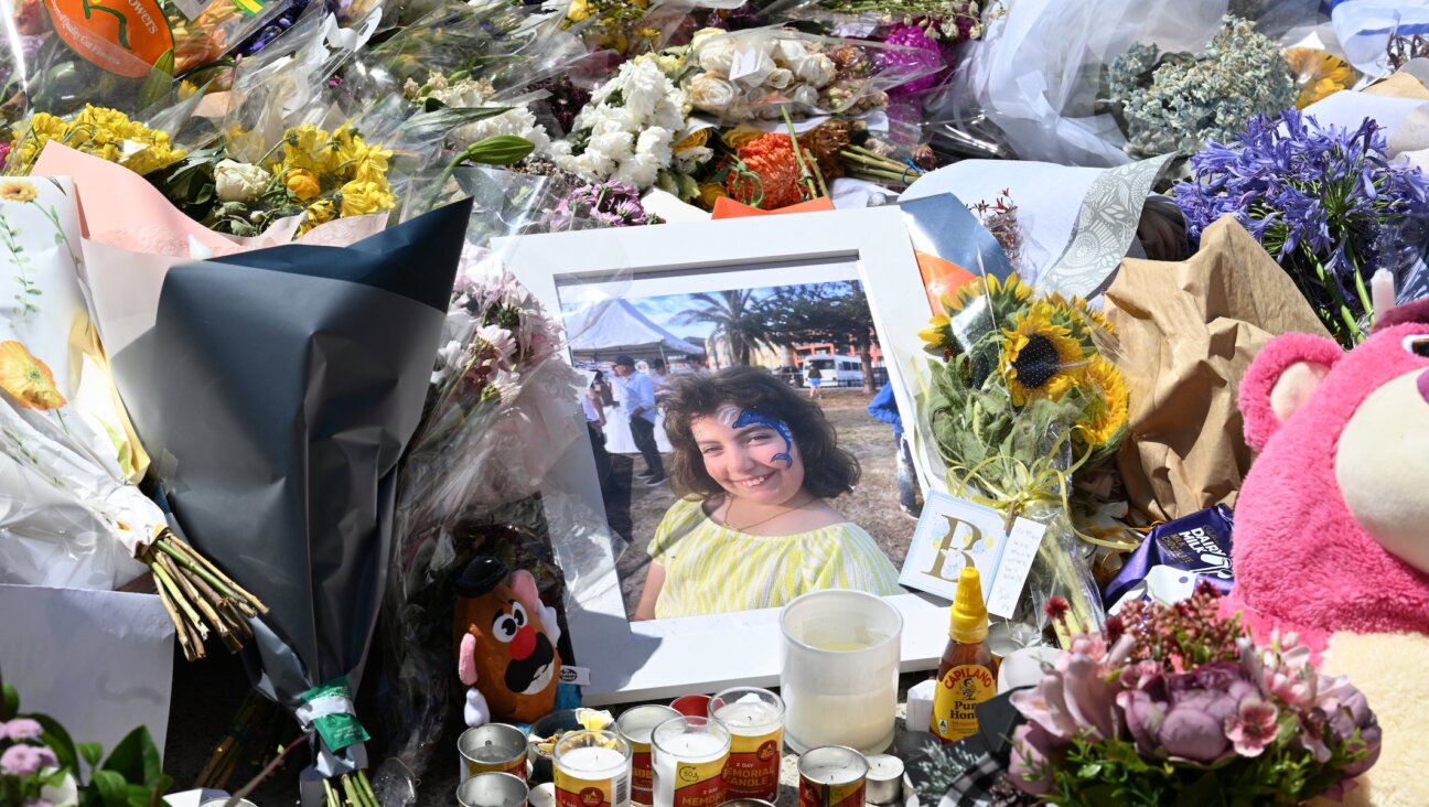 A portrait of 10-year-old Matilda, victim of the Bondi Beach shooting, sits on a flower memorial beside Bondi Pavilion on December 17, 2025 in Sydney, Australia.