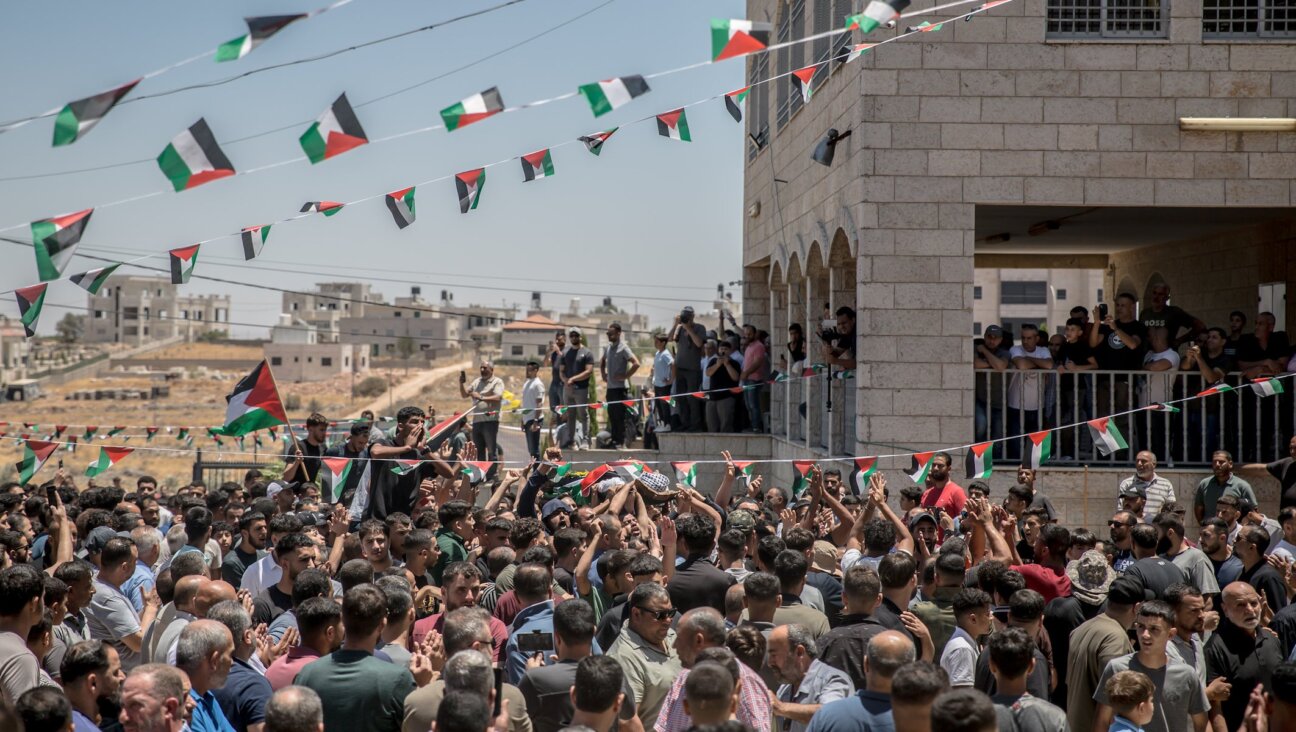 People gather for a funeral ceremony on July 13, 2025, for Ibrahim’s cousin, Sayfollah Musallet, 20, and Palestinian Mohammed Hussein Al-Shalabi, 23, who were killed during a confrontation with Israeli settlers.