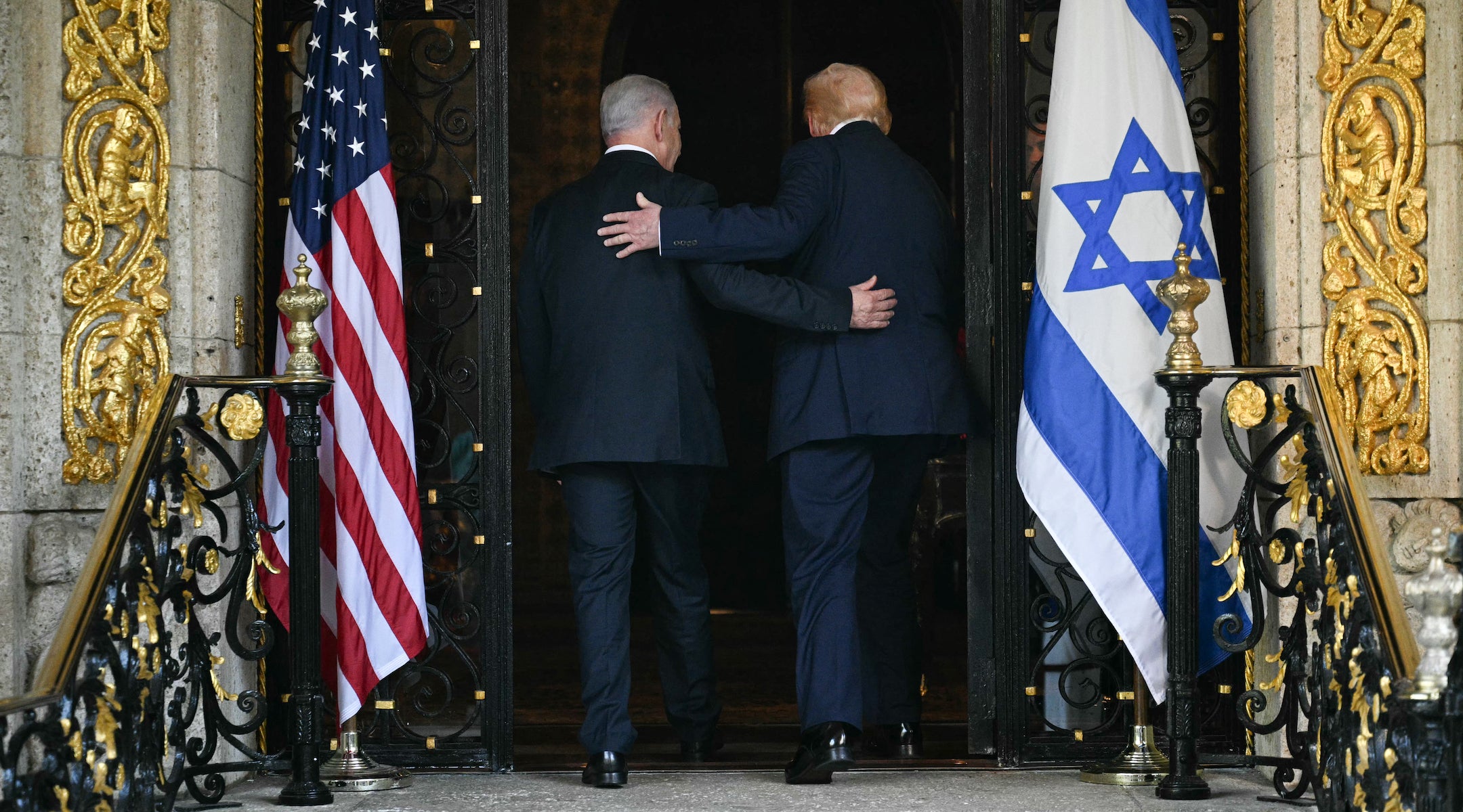 US President Donald Trump and Israeli Prime Minister Benjamin Netanyahu walk inside after Netanyahu arrived at Mar-a-Lago in Palm Beach, Florida on Dec. 29.