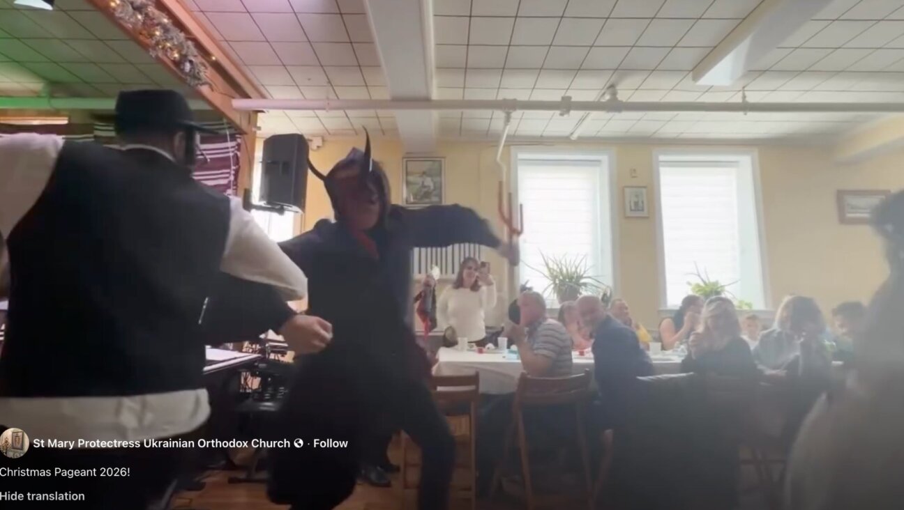“Moshko” the Jew dances with the devil in a Ukrainian Orthodox Christmas pageant held in New Jersey Jan. 11. 