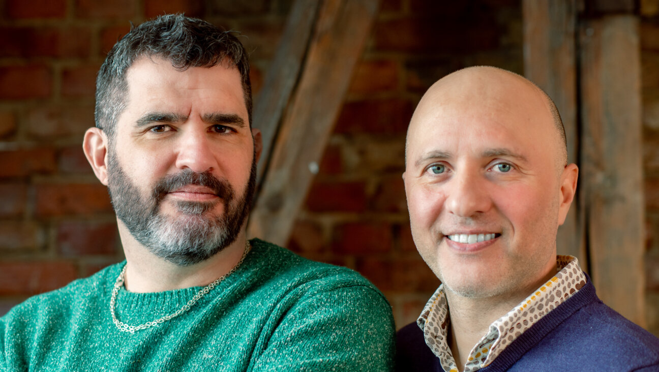 Altneuland Press' editor-in-chief Dory Manor (L) and publisher Moshe Sakal (R)