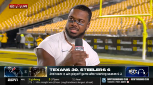 Azeez Al-Shaair, a longtime pro-Palestinian advocate, answers a postgame question while donning the message “STOP THE GENOCIDE” on his eye black, Jan. 12, 2026. (Screenshot via YouTube)