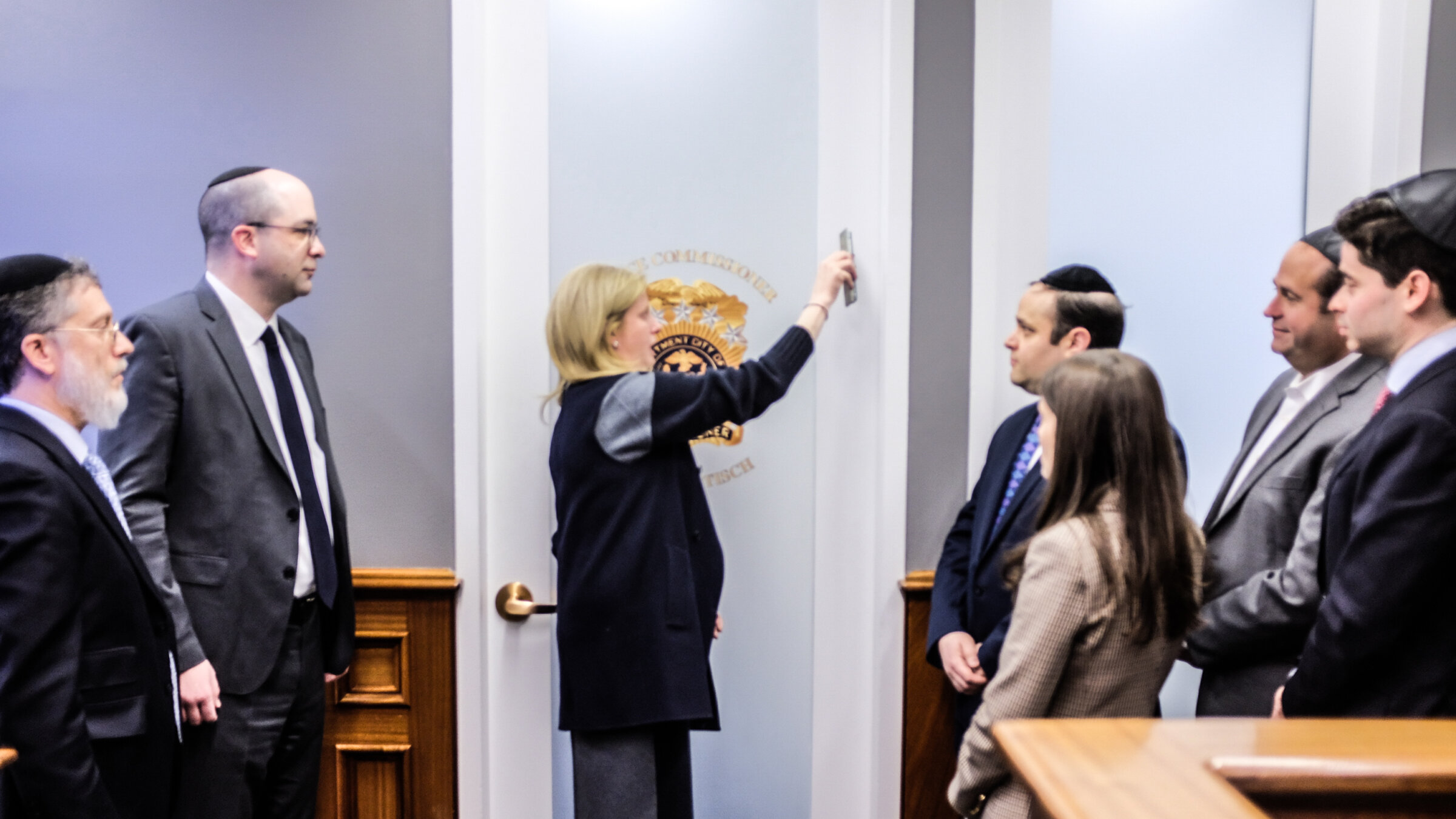 NYPD Commissioner Jessica Tisch placing a mezuzah at her office on Jan. 27. 