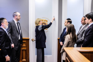 NYPD Commissioner Jessica Tisch placing a mezuzah at her office on Jan. 27. 