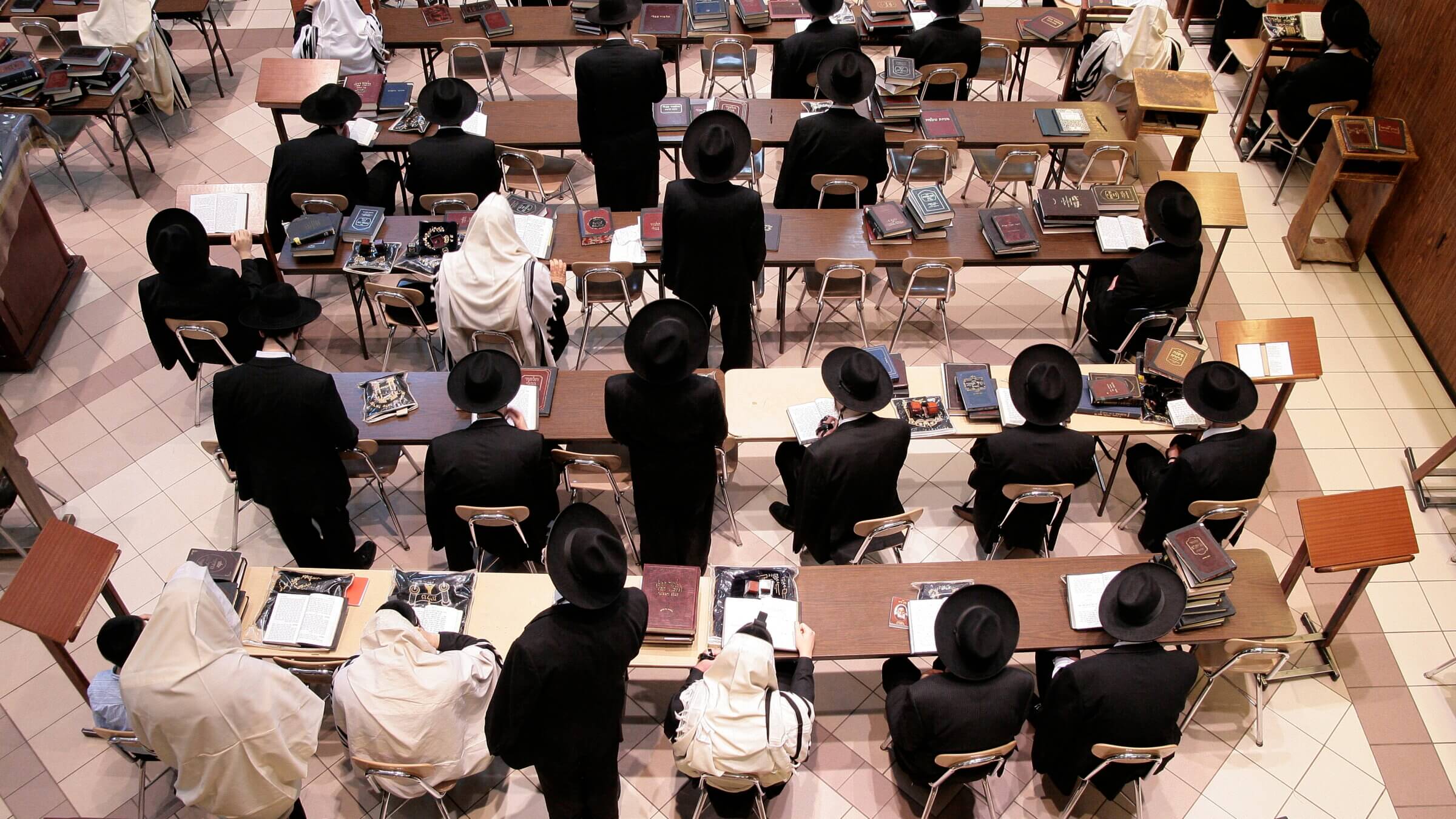 Early morning prayers at Yeshiva Gedolah Zichron Moshe, also known as the Yeshiva of South Fallsburg. The head of the yeshiva, Rav Elya Ber Wachtfogel, convened Haredi Orthodox leaders to discuss AI.