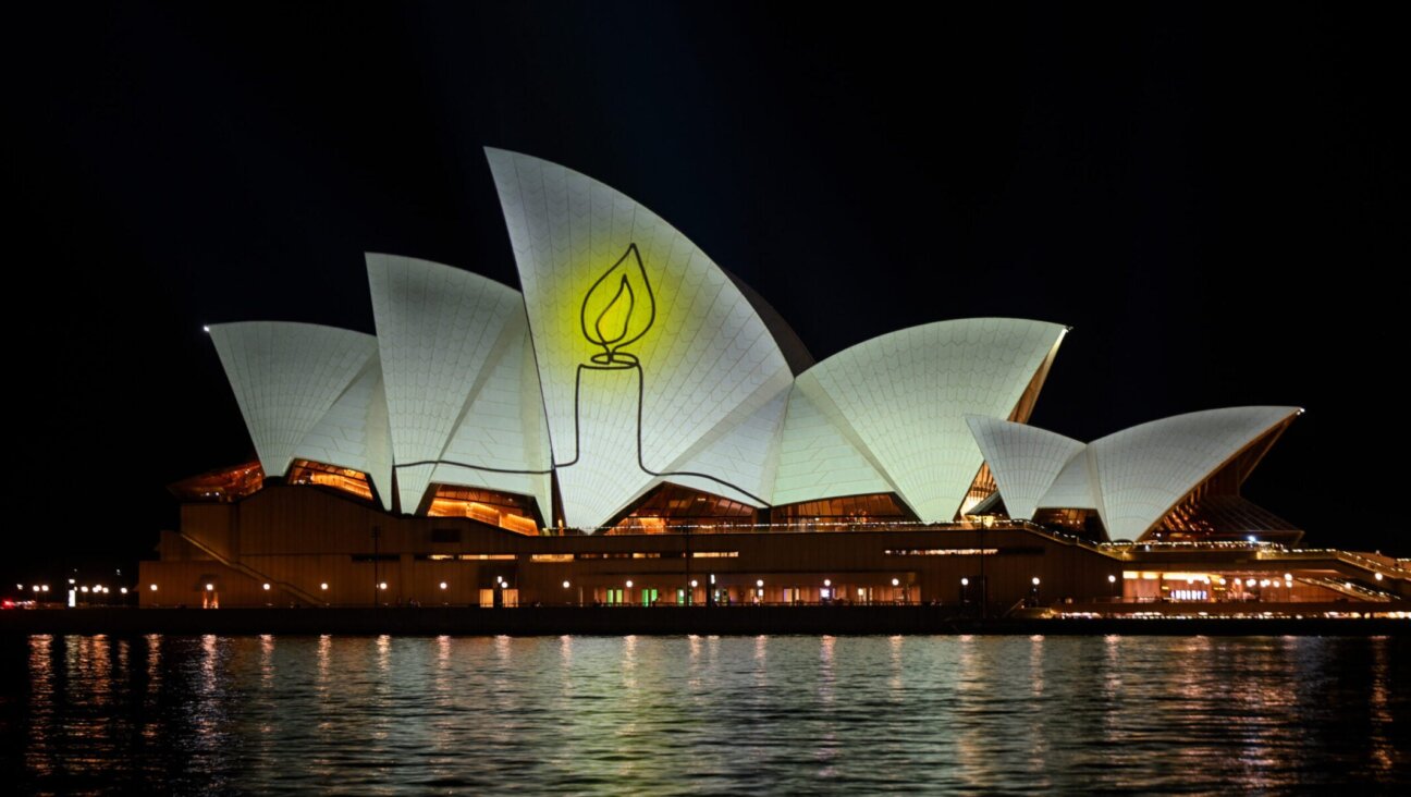 The Sydney Opera House is illuminated with candlelights in Sydney on Dec. 21, 2025, as part of a national day of reflection honoring the victims of the Bondi Beach Hanukkah terrorist attack on Dec. 21, 2025 in Sydney.