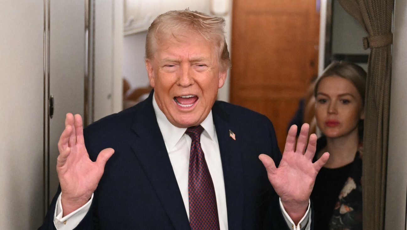  Donald Trump speaks to the press aboard Air Force One on Jan. 11, 2026. 