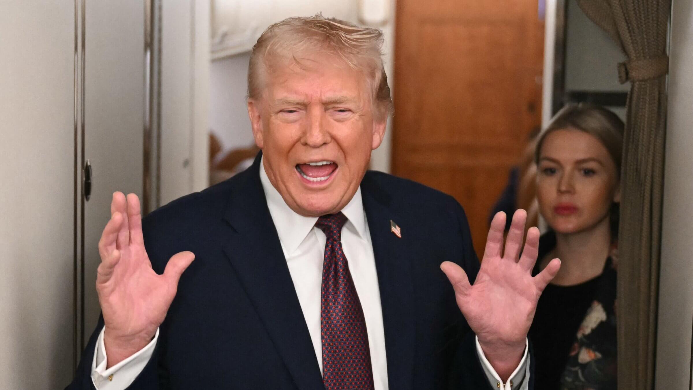  Donald Trump speaks to the press aboard Air Force One on Jan. 11, 2026. 