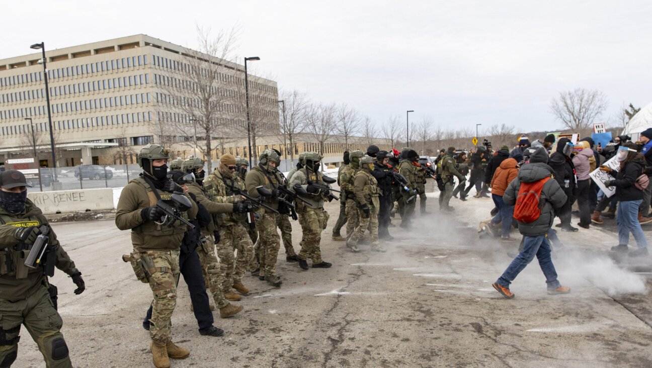 Federal agents shoot pepper balls at protestors outside an ICE facility during a protest against U.S. Immigration and Customs Enforcement (ICE), Jan. 11, 2026. 