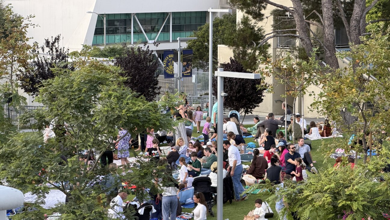 A year away from their synagogue forced Kehillat Israel to hold events in esoteric, often far-flung locations. Above, the congregation gathers after Rosh Hashanah services at a high school in Santa Monica.