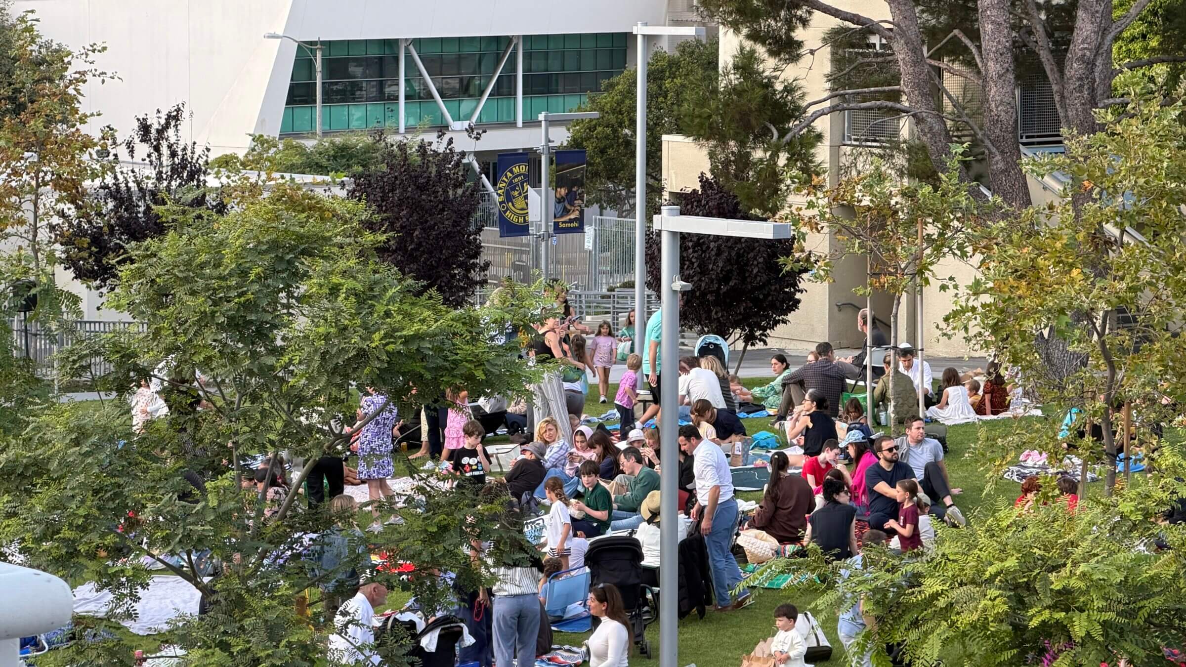 A year away from their synagogue forced Kehillat Israel to hold events in esoteric, often far-flung locations. Above, the congregation gathers after Rosh Hashanah services at a high school in Santa Monica.