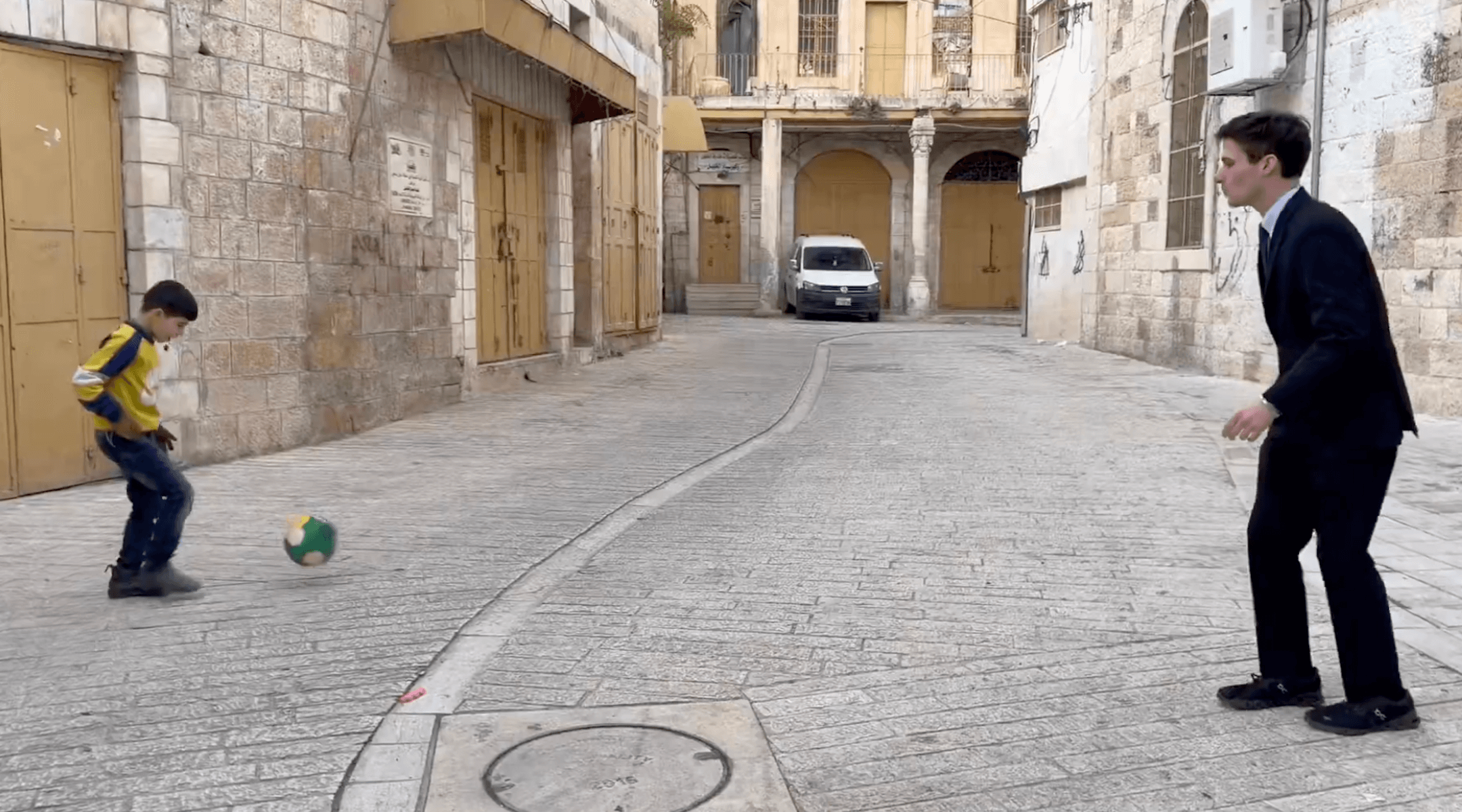 Congressional candidate Cameron Kasky playing soccer with a Palestinian child during his trip to the West Bank, Dec. 2025. 