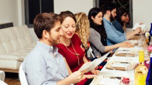 People gather at a OneTable Shabbat dinner. 