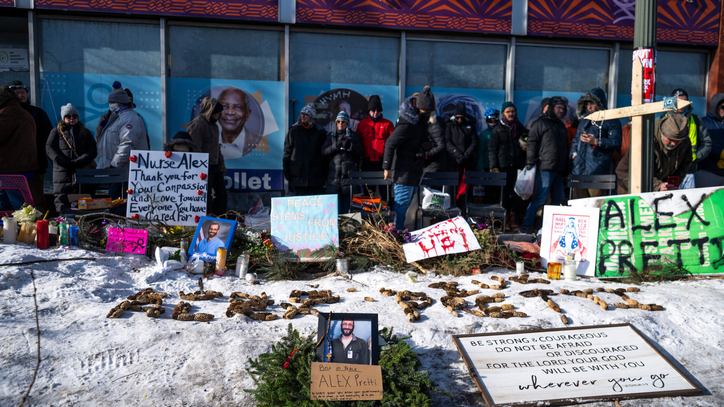 People gather during a vigil held by healthcare workers at a memorial for Alex Pretti on Jan. 25 in Minneapolis, Minnesota.