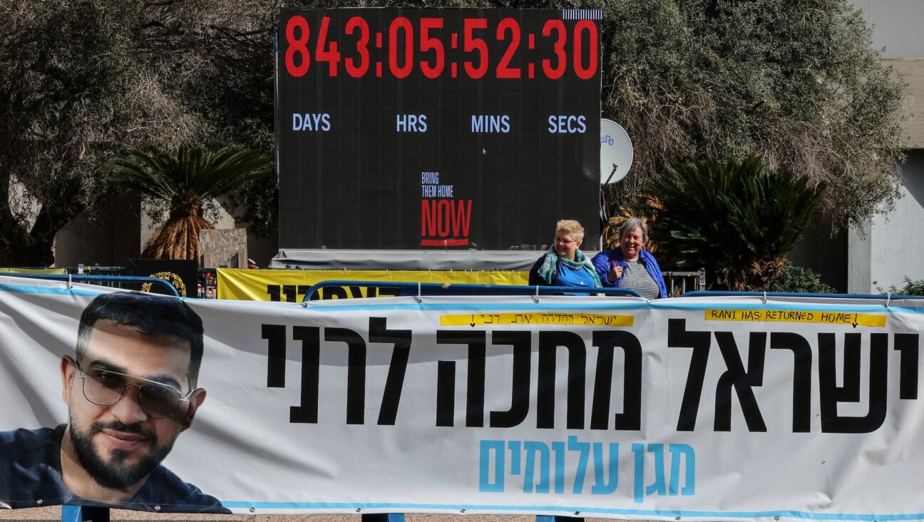 A photograph shows a banner bearing a portrait Ran Gvili, the last hostage held in Gaza, the day after his remains were brought home by Israeli forces, in Hostage Square in Tel Aviv on Jan. 27, 2026.