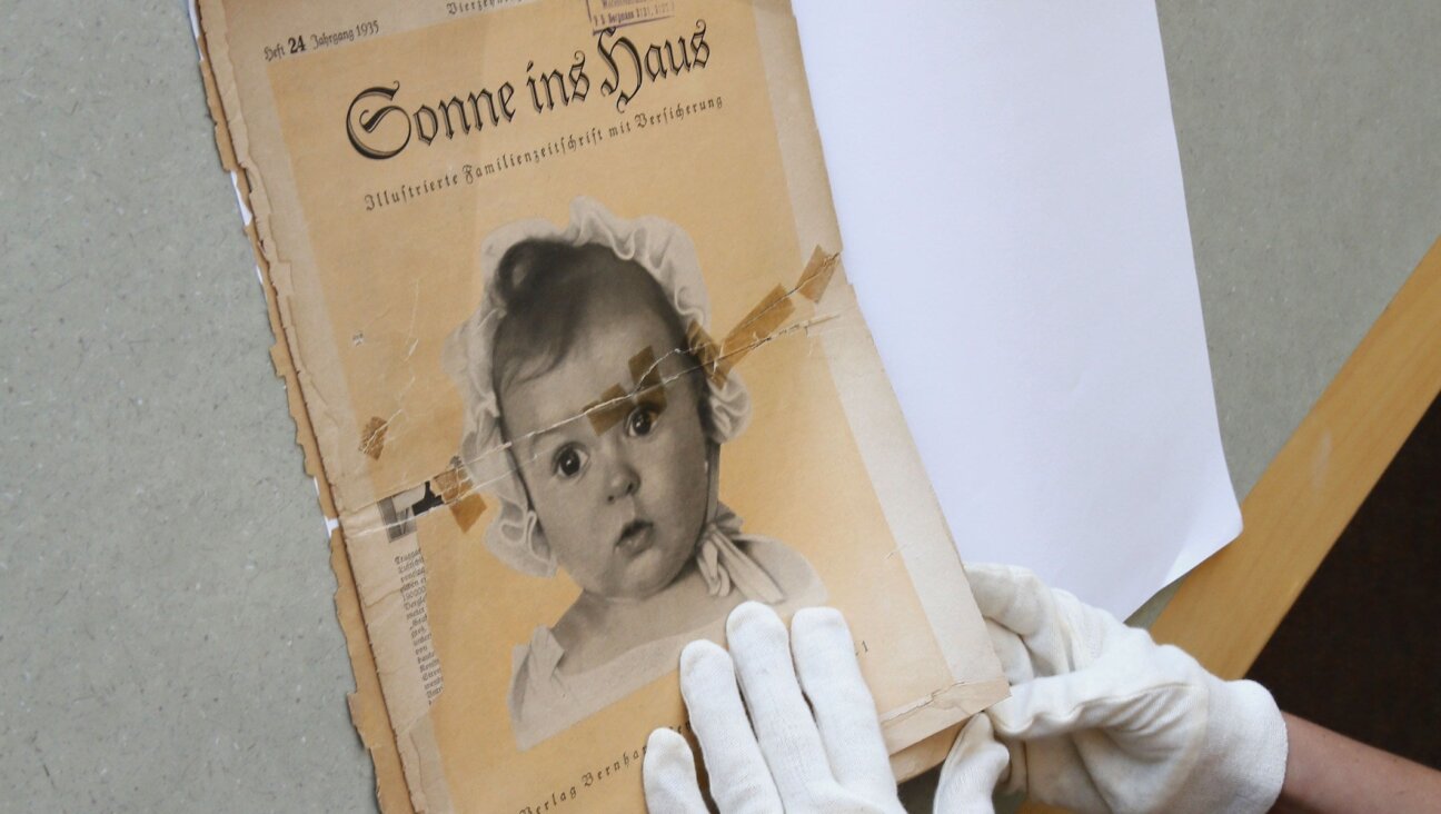 At the archives of the Yad Vashem Holocaust memorial museum, the front page of the original issue of the Nazi family magazine 'Sonnie ins Hous' (Sunshine in the House) shows baby Hessy Taft as the ideal German Aryan baby. Taft was Jewish.