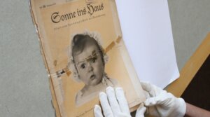 At the archives of the Yad Vashem Holocaust memorial museum, the front page of the original issue of the Nazi family magazine 'Sonnie ins Hous' (Sunshine in the House) shows baby Hessy Taft as the ideal German Aryan baby. Taft was Jewish.