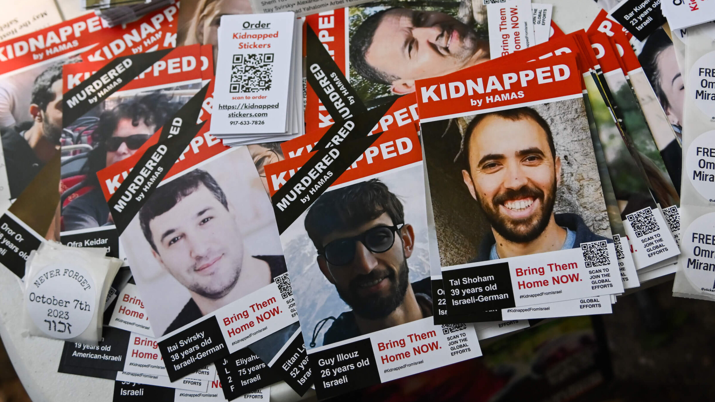 Posters of Israeli hostages are seen during a rally to mark the first anniversary of the Oct. 7 Hamas attack on Israel on Oct. 6, 2024 in New York City.