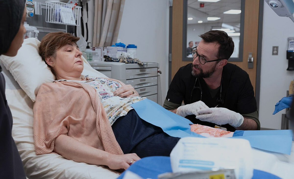 Irina Dubova, left, and Noah Wyle in a scene from "The Pitt." Dubova portrays a survivor of the Tree of Life synagogue shooting who is still experiencing trauma years later.