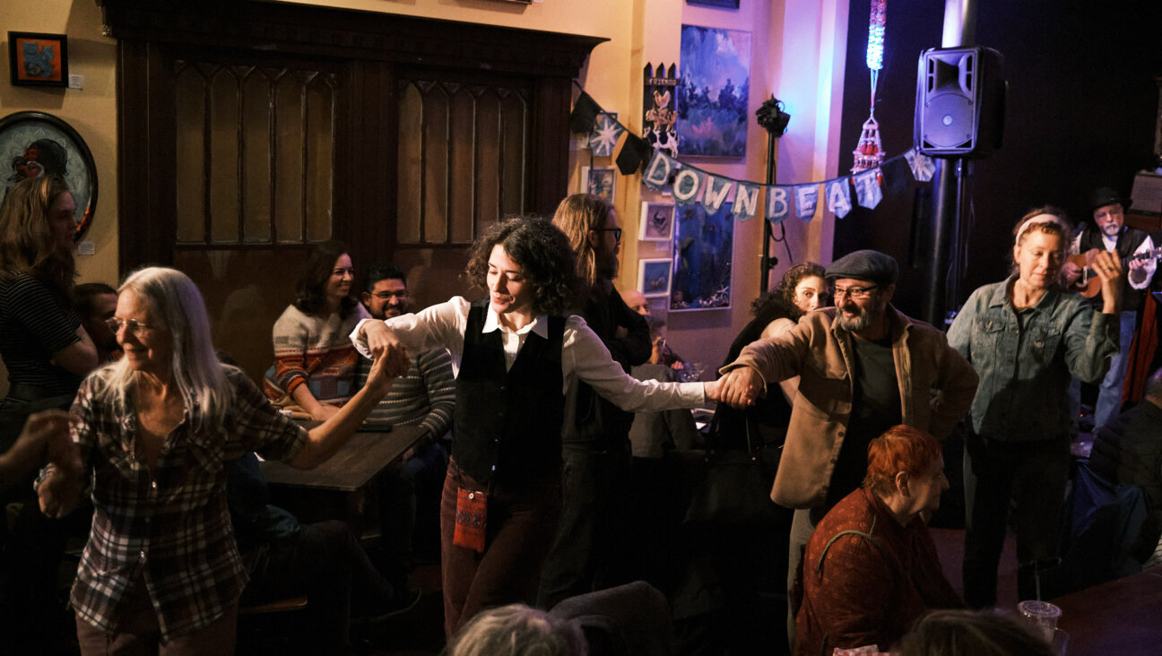 People dancingon the first night of the Richmond Yiddish Week festival, Jan. 10, at the Gold Lion Community Café in Richmond, Virginia. 