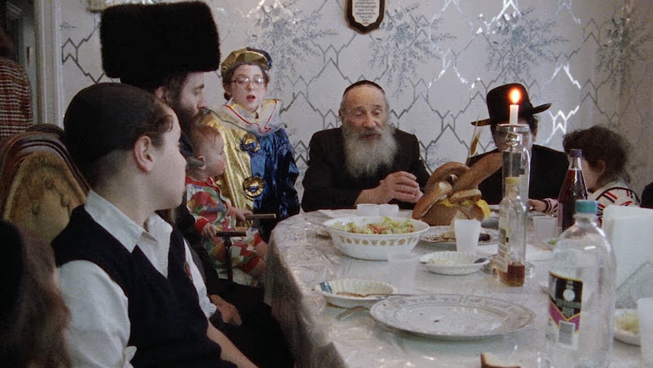 A scene in Yiddish of a Hasidic family celebrating Purim.