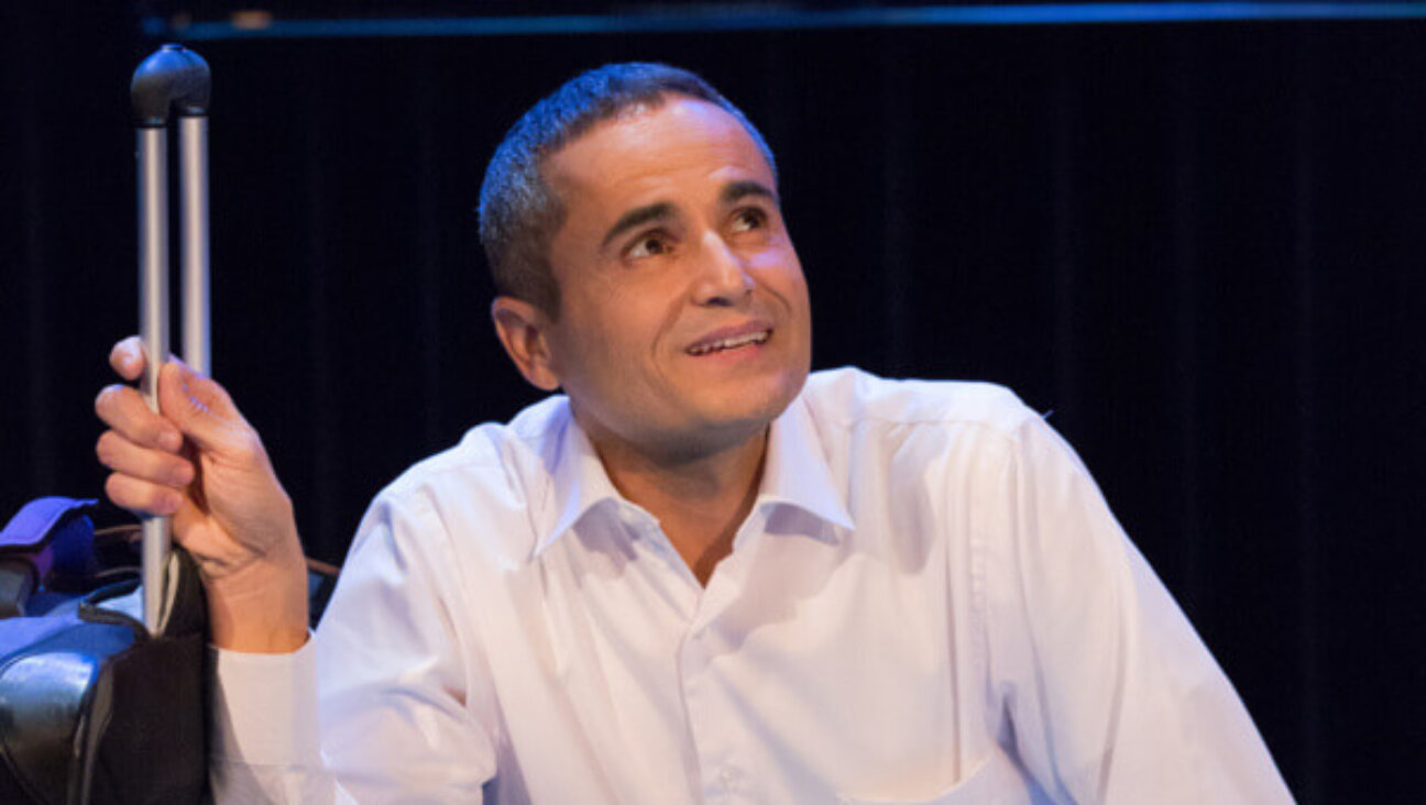 Miari, with a suitcase that will cause him oh-so-much-trouble