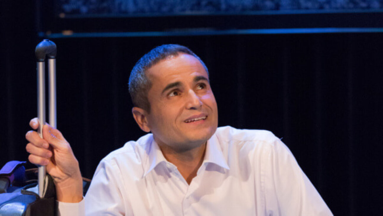 Miari, with a suitcase that will cause him oh-so-much-trouble