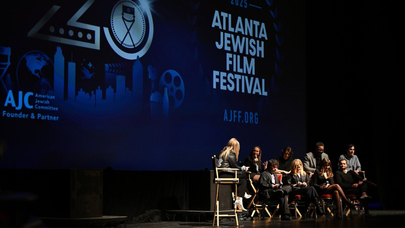 Panelists from the Atlanta Jewish Film Festival speak onstage.