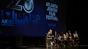 Panelists from the Atlanta Jewish Film Festival speak onstage.