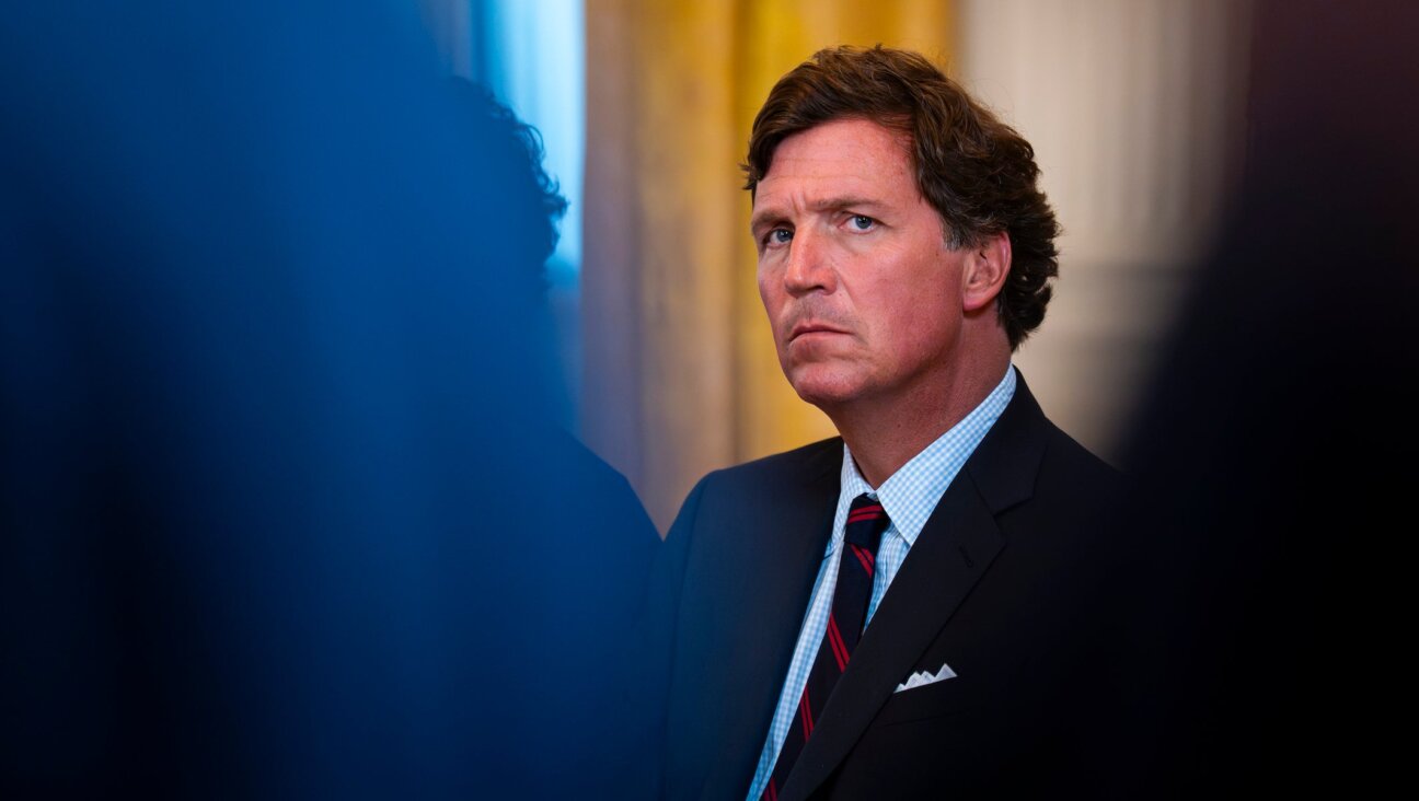 Tucker Carlson, former FOX News host and current host of The Tucker Carlson Show, attends a meeting with oil executives in the East Room of the White House on January 9, 2026 in Washington, DC. (Al Drago/Getty Images)
