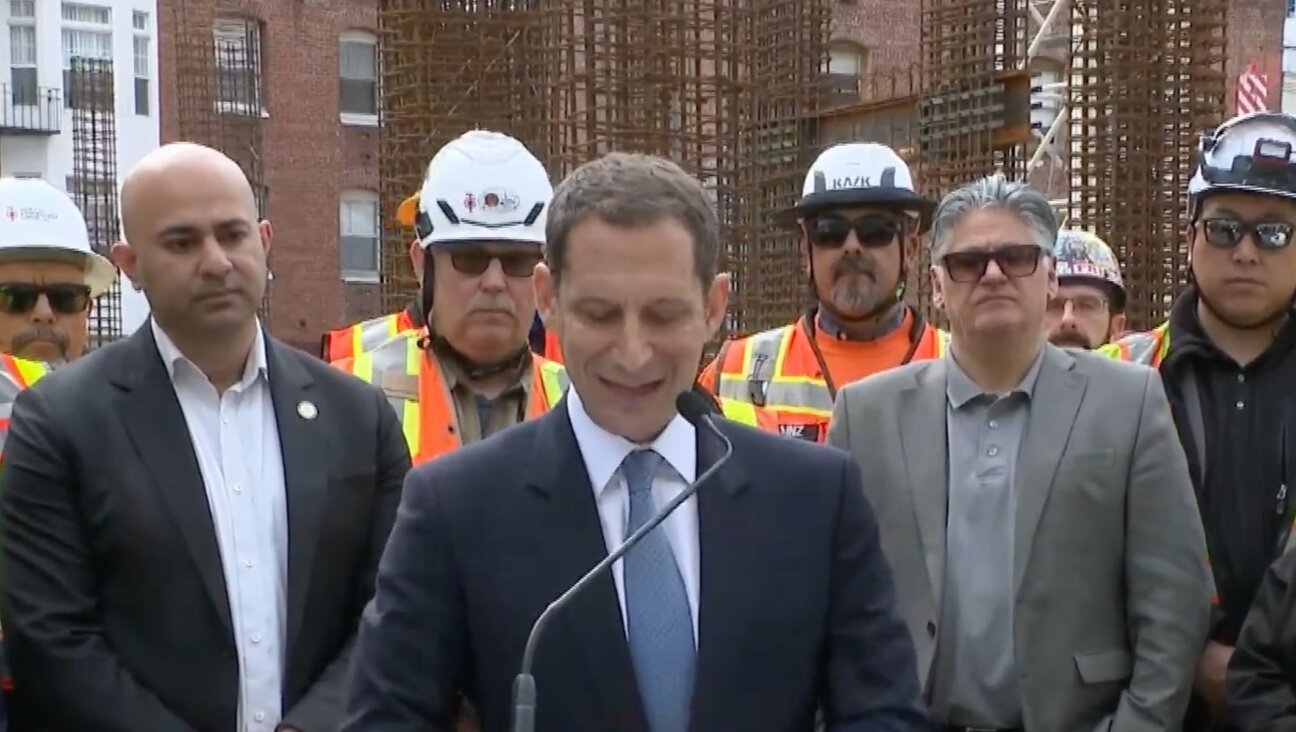 San Francisco Mayor Daniel Lurie delivers a press conference during which a disruptor chanted “tax the Jews.” 