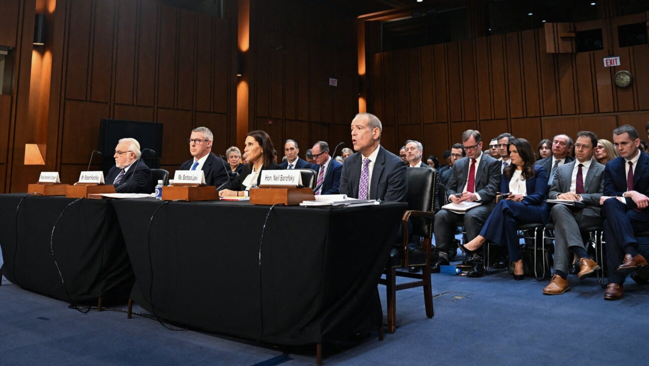 From left to right: Rabbi Abraham Cooper, Robert Karofsky, Global Wealth Management President at UBS Americas, Barbara Levi, General Counsel at UBS Group AG, and Neil Barofsky, partner at Jenner and Block LLP, testify during a Senate Judiciary Committee hearing.