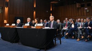 From left to right: Rabbi Abraham Cooper, Robert Karofsky, Global Wealth Management President at UBS Americas, Barbara Levi, General Counsel at UBS Group AG, and Neil Barofsky, partner at Jenner and Block LLP, testify during a Senate Judiciary Committee hearing.