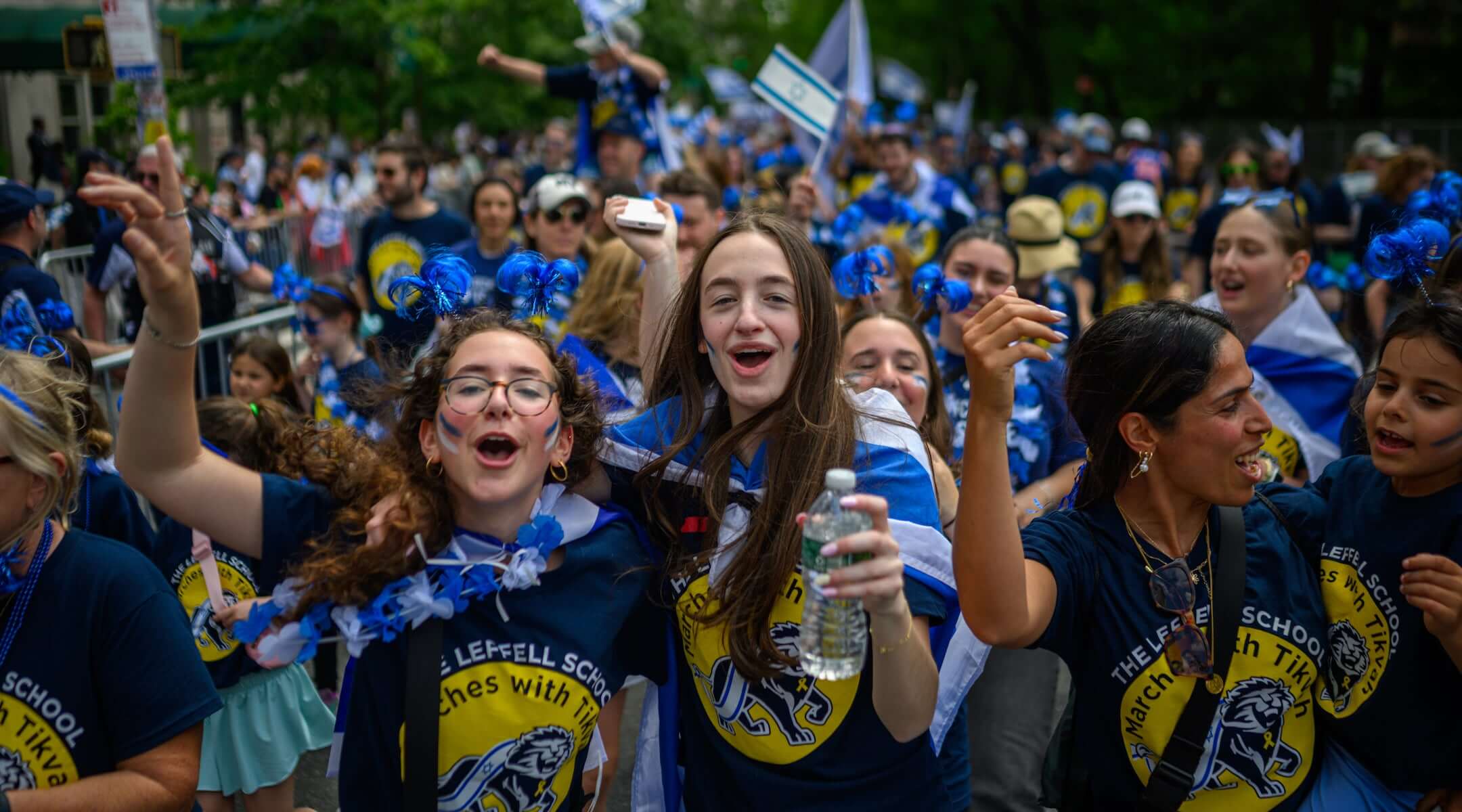 Participants cheer and dance during the Celebrate Israel Parade up Fifth Avenue on May 18, 2025 in New York City.