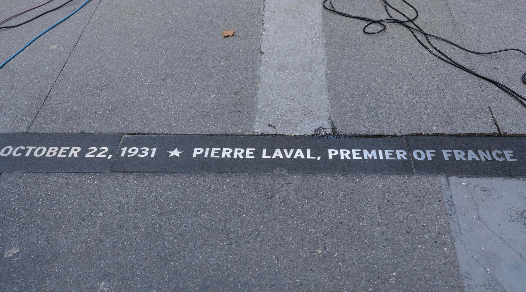 Closeup view of a plaque inscribed with the name of Pierre Laval, the former prime minister of France turned Nazi collaborator, who was once honored with a ticker-tape parade in New York City. 