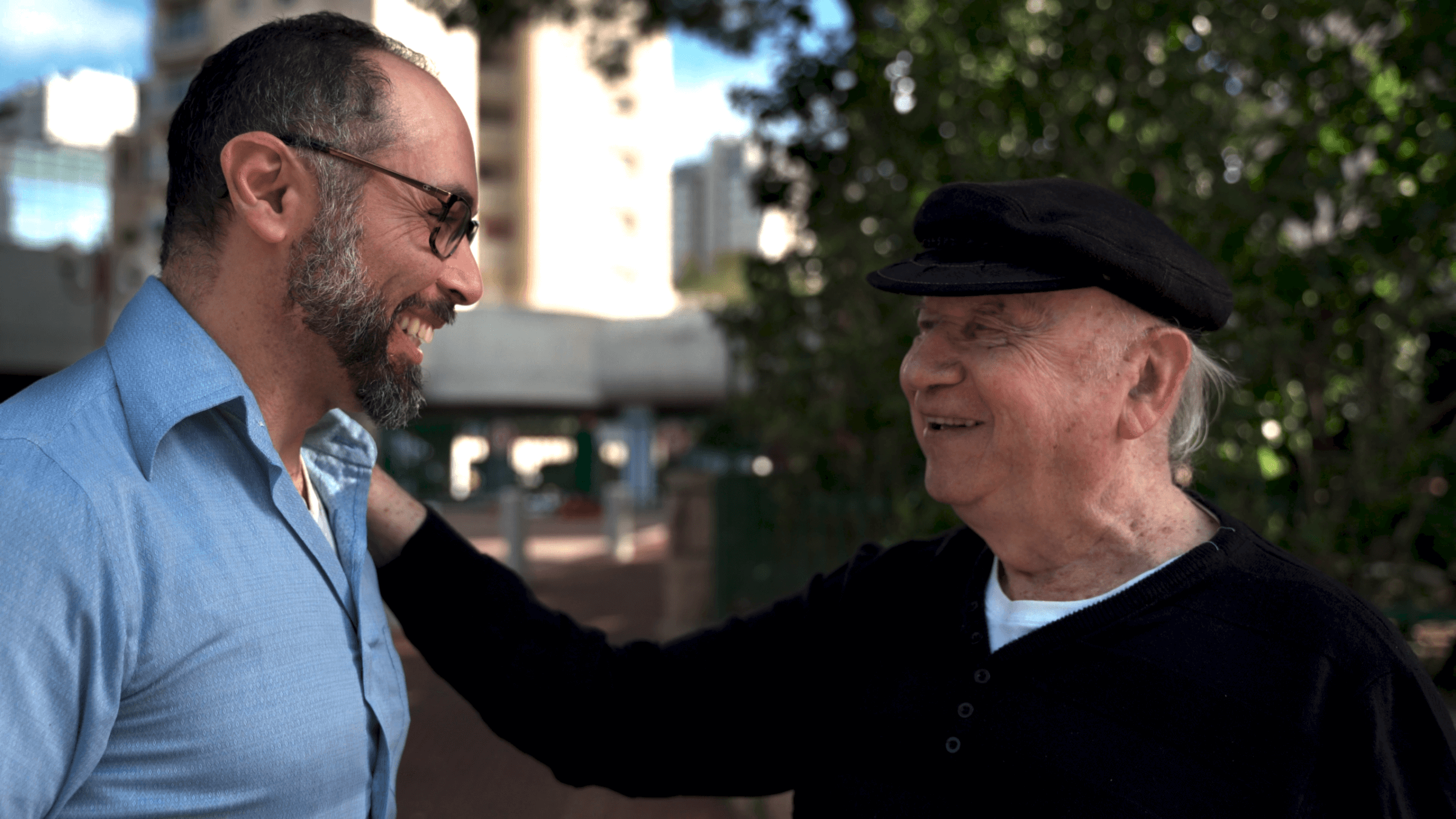 Director Yoav Potash greets Yaacov Goldstein, one of the last Jewish survivors of Gniewoszów, Poland. (Courtesy of 8 Above)