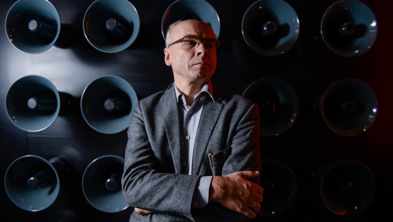 Dariusz Stola stands inside an exhibit about the antisemitic persecution of Polish Jews in 1968, Feb. 19, 2020.