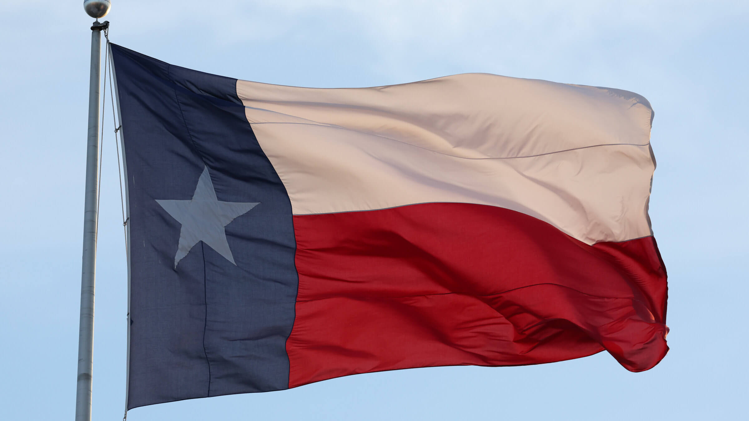 A Texas flag waves over the Lone Star State, 2025. 