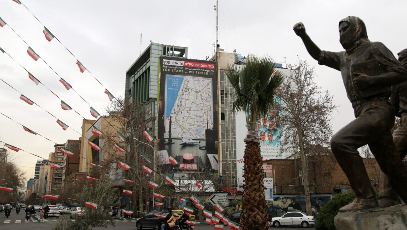 A giant billboard displaying a map of potential targets in Israel’s Tel Aviv area along with a warning message reading “You start, we finish!” is seen at Palestine Square in Tehran, Iran, Feb. 9, 2026.