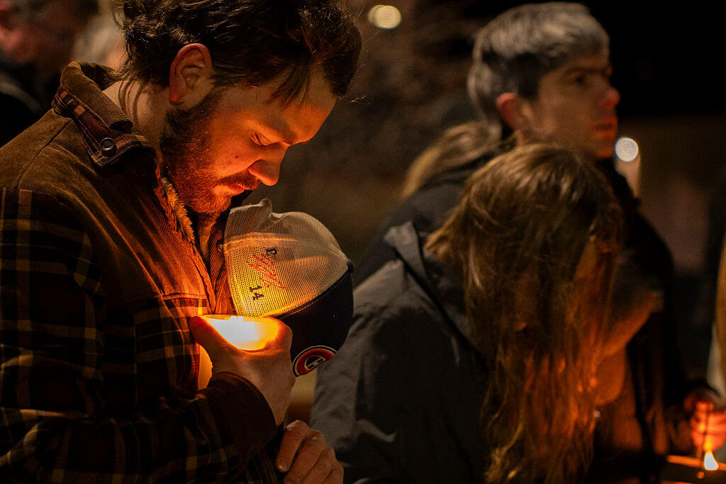 Residents of Tumbler Ridge, British Columbia attend a candlelight vigil Feb. 12, for the victims of a mass shooting. 